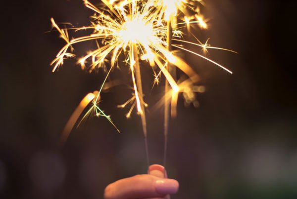 Hand holding a sparkler