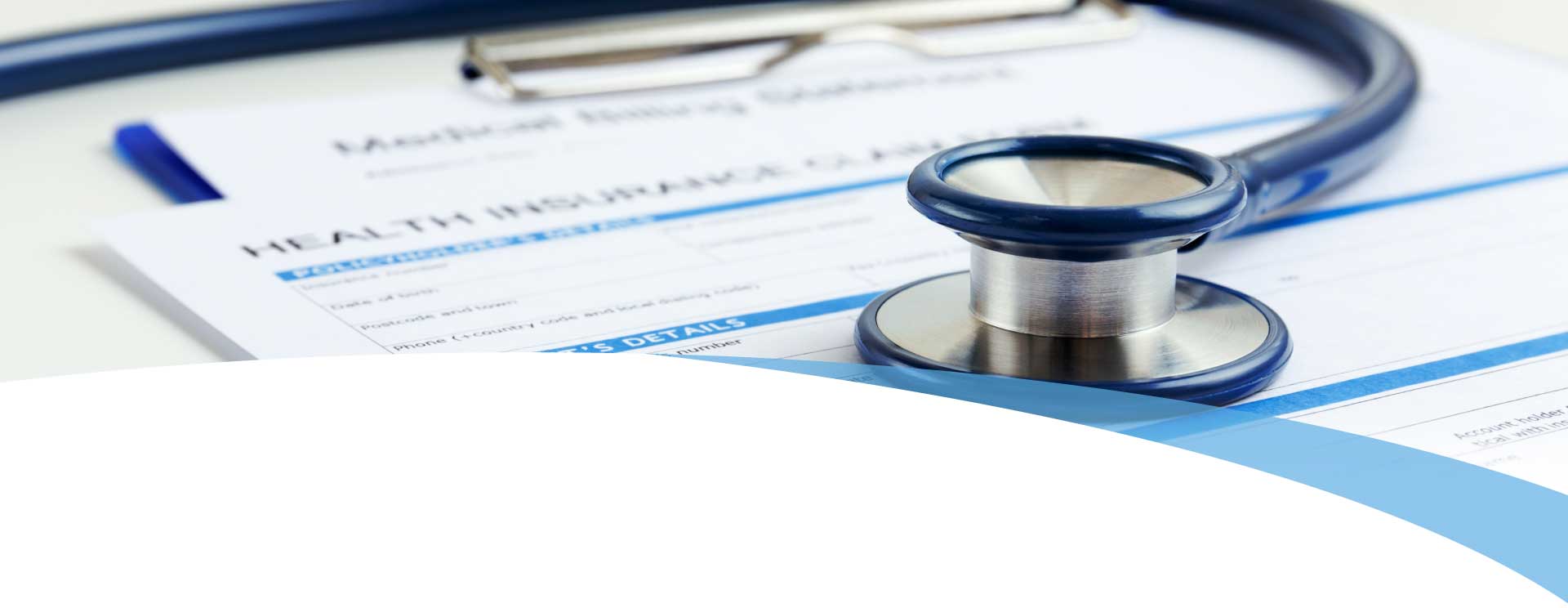 Stethoscope on Health Insurance paperwork