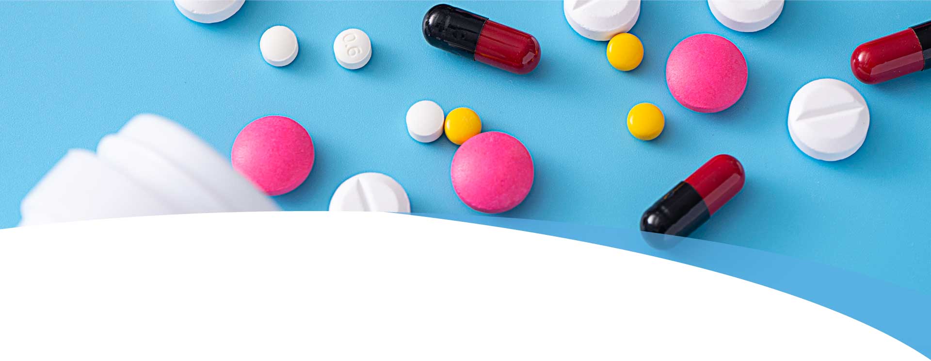 Colorful Pills on a Blue Background