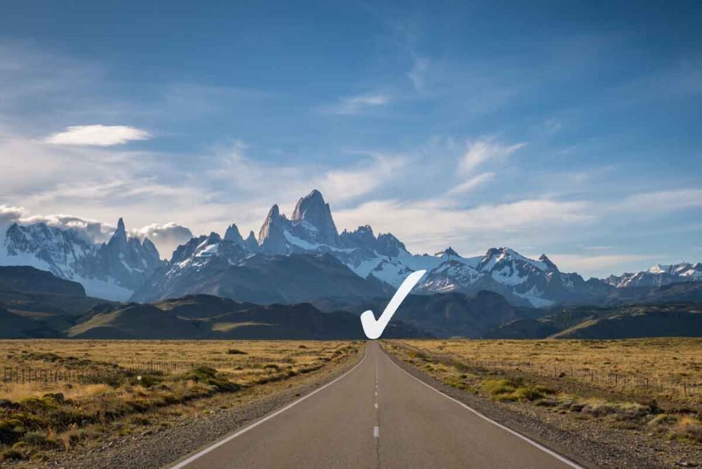 Road towards Mountainous Horizon with a checkmark on the horizon